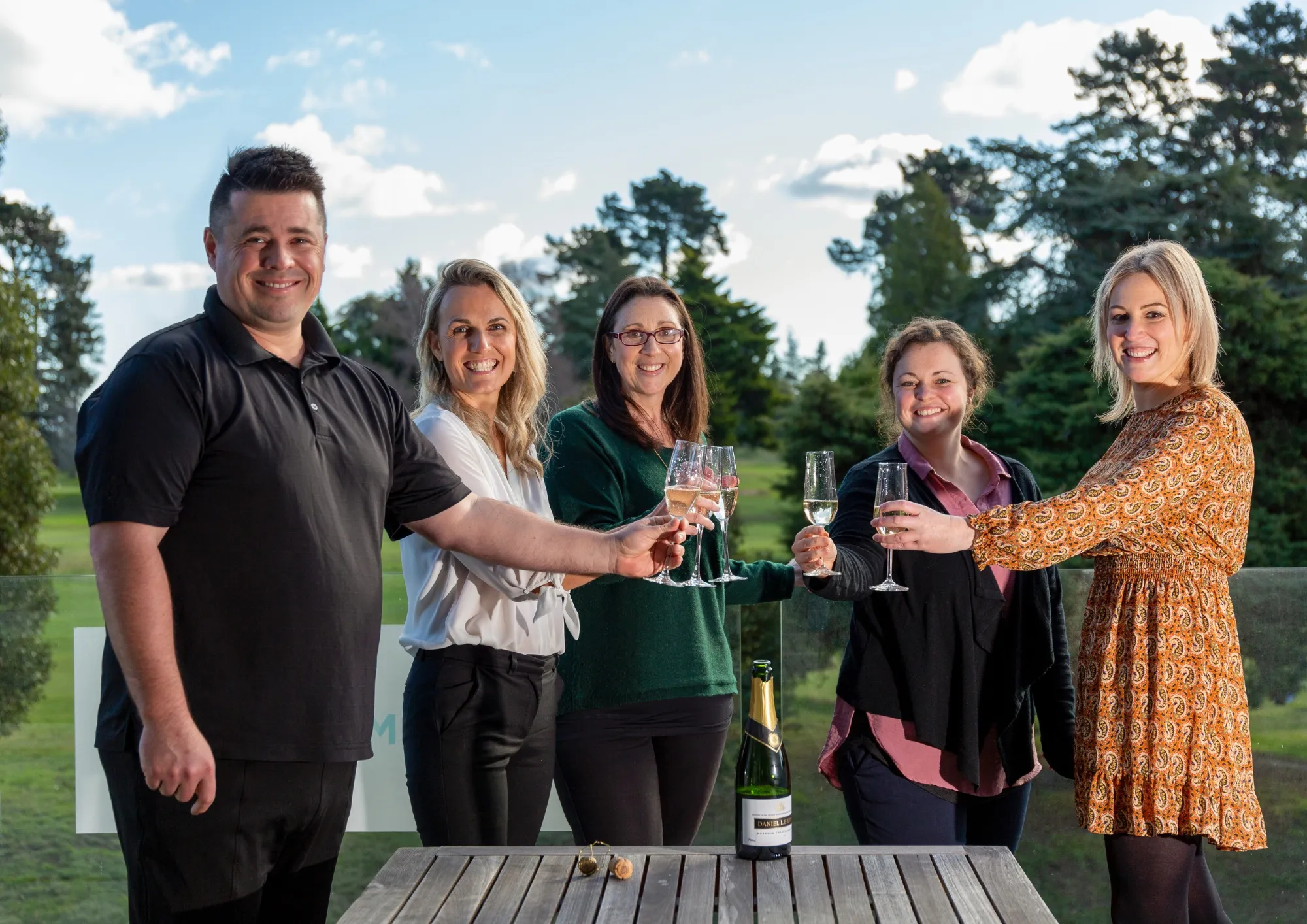 10 years of C i Marketing. Team celebrating on balcony in Christchurch office. 2023