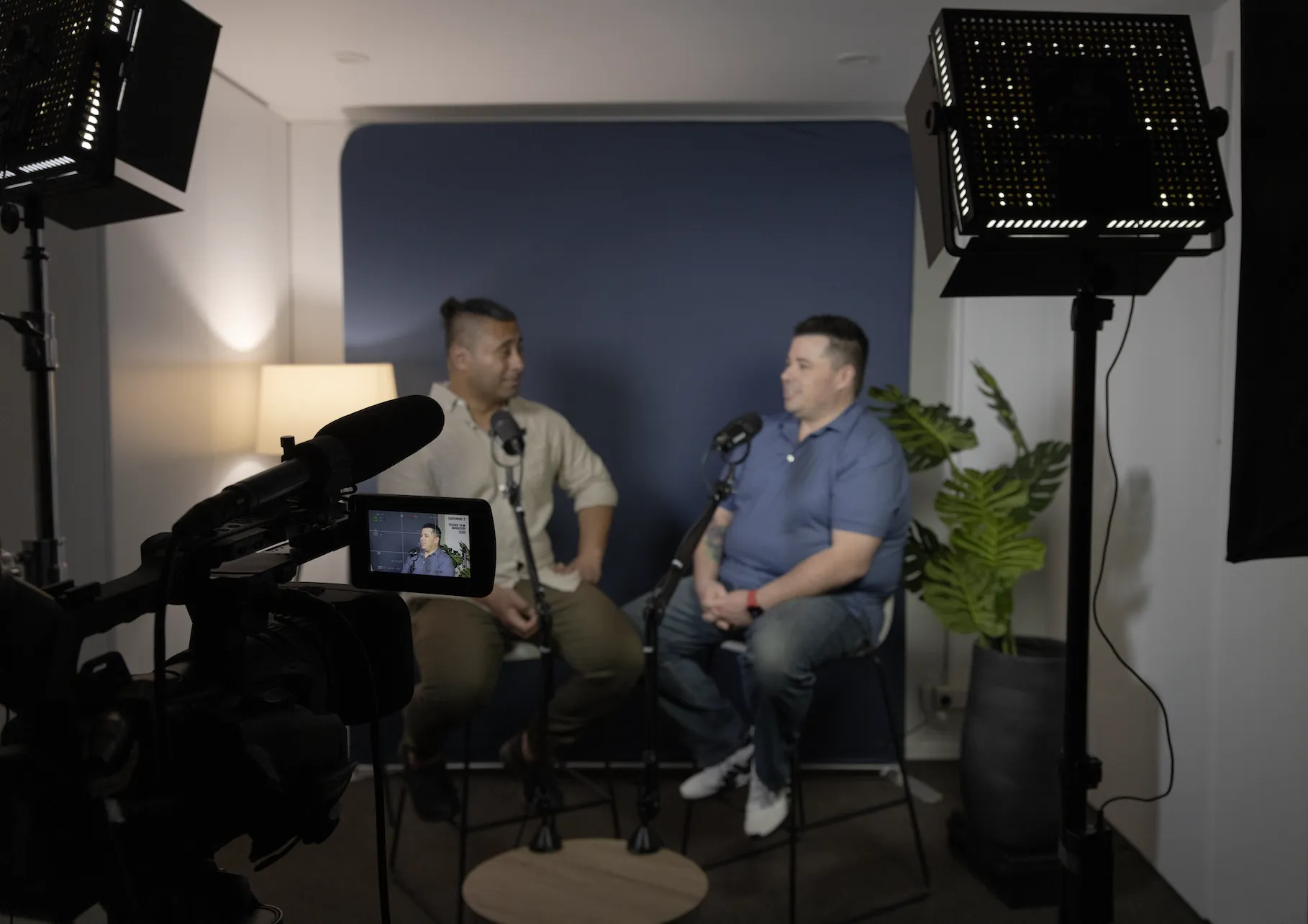 C i Marketing onsite studio Christchurch_two men chatting in front of camera-behind the scenes shot. 2023 NZ
